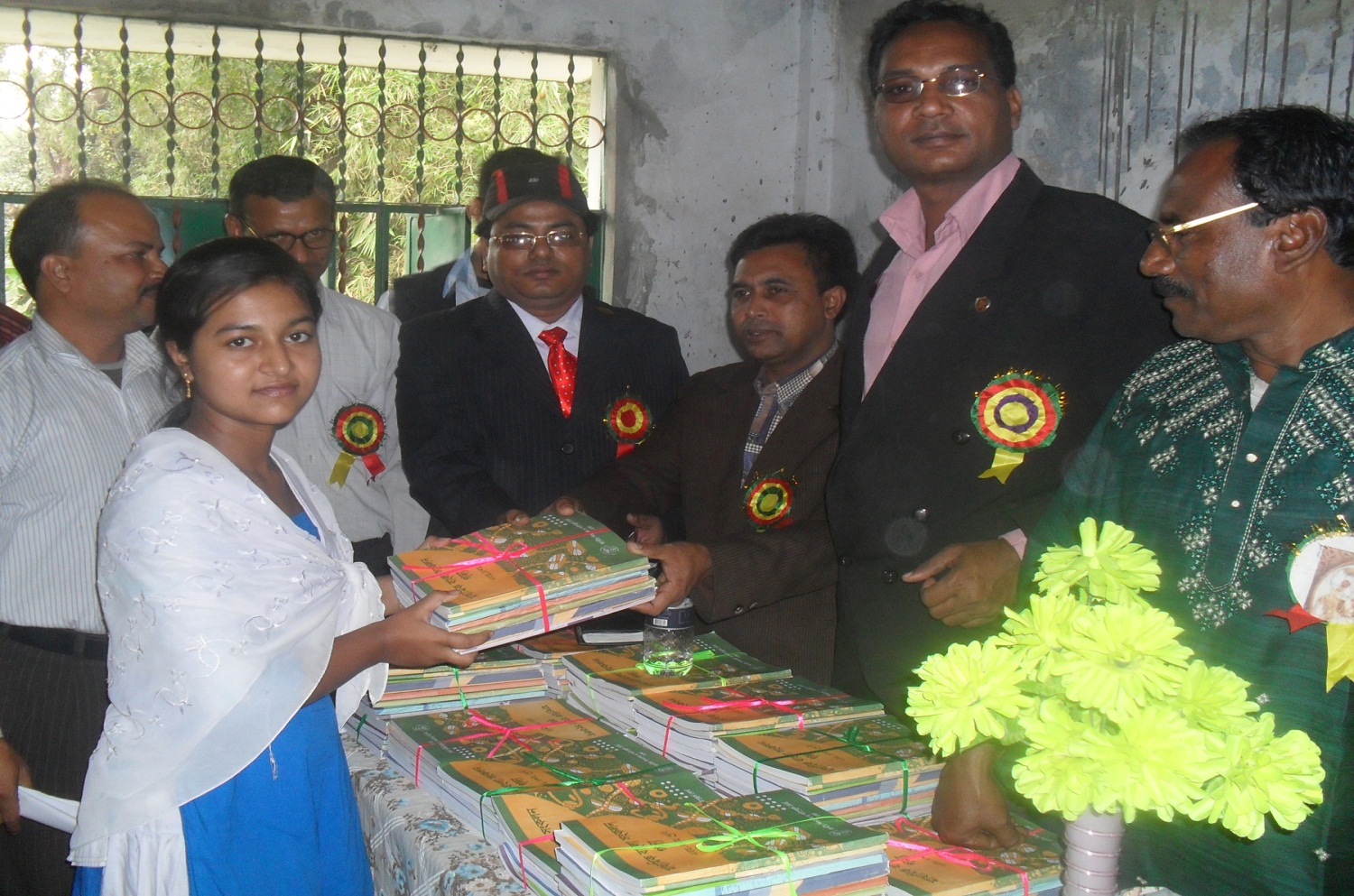 On the occasion of New Year, Begumganj-Sonaimuri Shikkha O Sastha Unnayan Foundation Chairman Md. Gias Uddin Mithu is handing out books among the students of different educational institutions.