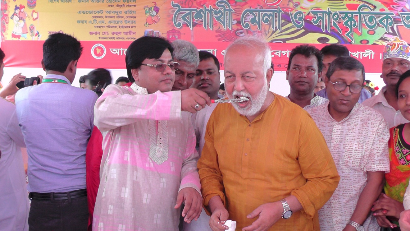 In the Picture- Chairman of Begamganj-Sonaimuri Shikkha O Sastha Unnayan Foundation and Principal, Begumganj Technical & Computer Institute Md. Giash Uddin Mithu is giving sweet food to Zilla Parishad chairman AB Zafar to Ullah On the first day of Pohela Baisakh.