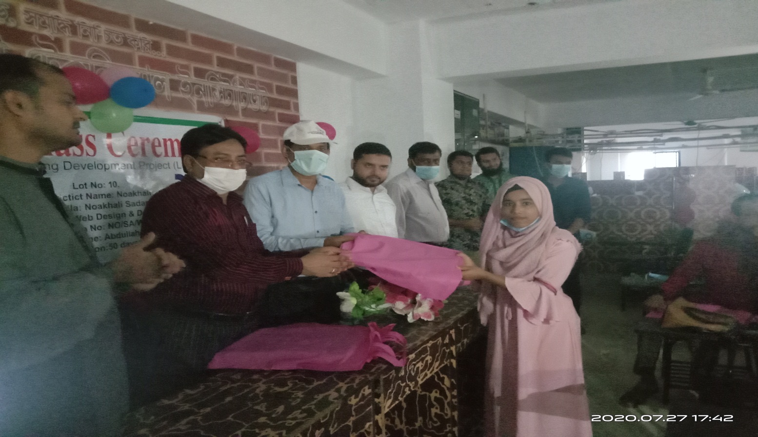 Begumganj Technical School and College Principal Utpal Kumur Bhiyan and Begumganj-Sonaimuri Shikkha O Sastha Unnayan Foundation Chairman Gias Uddin Mithu hands over prizes to students at the closing ceremony of Learning and Learning Course.